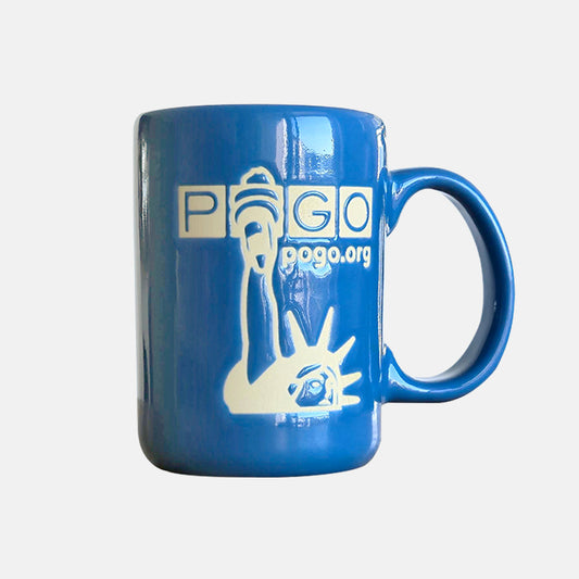 Blue glazed ceramic mug on a grey background. The mug has a tall handle and a matte off-white design of unglazed clay showing the Statue of Liberty, POGO logo, and text: pogo.org.